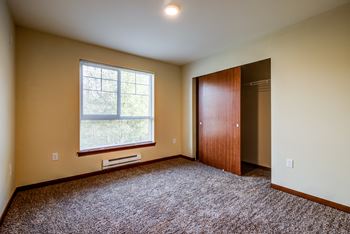 Bedroom with closet and window